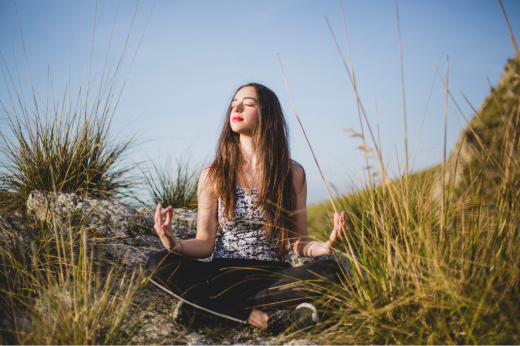 woman doing yoga or medication, practicing self-care to help with relationship conflict resolution