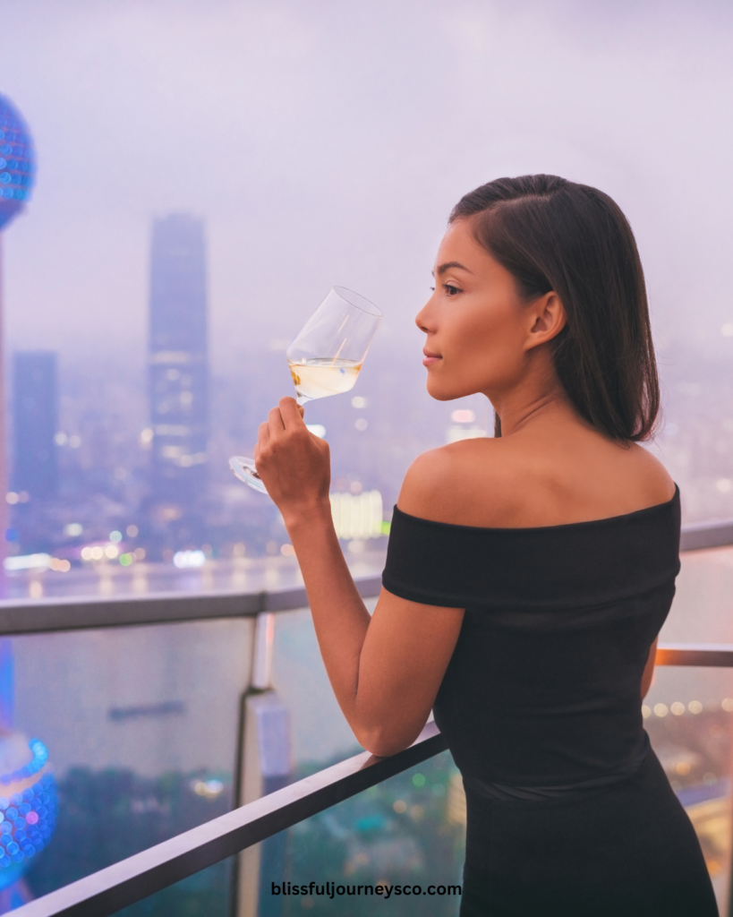 woman, successful woman, rich woman, rich woman on a balcony, what to spend money on as a woman, how to invest in yourself as a woman, how to spend money as a woman